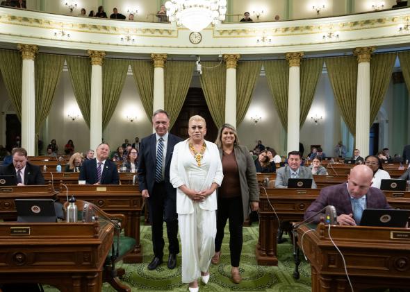 Bamby Salcedo flanked by Assemblymember Zbur and Menjivar on the Assembly floor