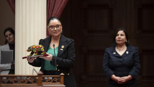 2025 Latino Spirit Award Honoree Angélica Salas being introduced to Senators by Latino Caucus Chair, Senate Majority Leader Lena Gonzalez
