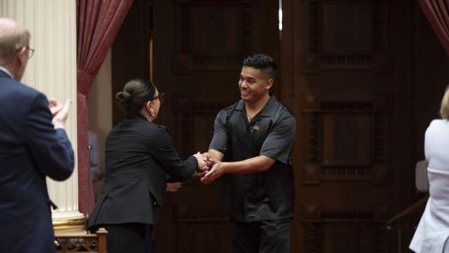 2025 Latino Spirit Award Honoree Jesús Morales being introduced to Senators by Latino Caucus Chair, Senate Majority Leader Lena Gonzalez