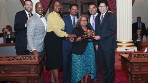 Barbara Torres pictured with Senators Ben Allen, Isadore Hall, Holly Mitchell, Ben Hueso, Ricardo Lara and Senate President pro tem Kevin de León