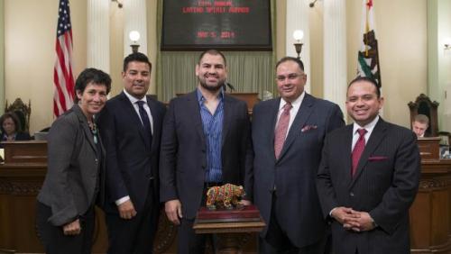 2014 Latino Spirit Award Honoree Cain Velasquez, Achievement in Athletics. Cain Velasquez is a mixed martial artist fighting in the Ultimate Fighting Championship (UFC) where he is the heavyweight champion. He is a first-generation American with deep pride in his Mexican heritage, and is the first Latino ever to win the world heavyweight title in any major combat sport.  Velasquez has a strong claim to being one of the best heavyweights ever as a two-time and reigning UFC champion. He has already set UFC be