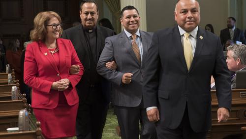Father Miguel Ceja (Achievement in Human Rights) escorted by Asm. Eloise Gómez Reyes, Asm. Eduardo Garcia and Asm. Freddie Rodriguez